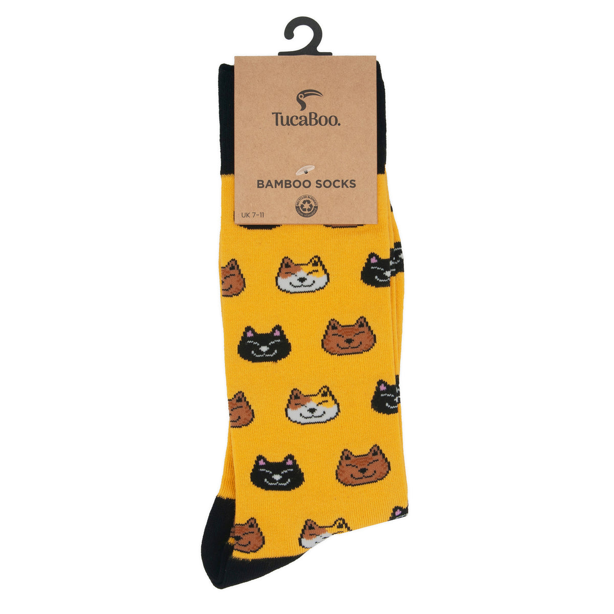 Mustard yellow cat socks in TucaBoo kraft card packaging