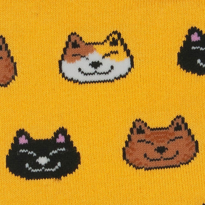 Close-up of the cat faces on mustard yellow bamboo socks