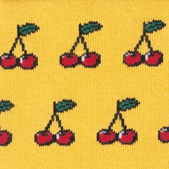 Close-up of the red cherries on yellow bamboo socks
