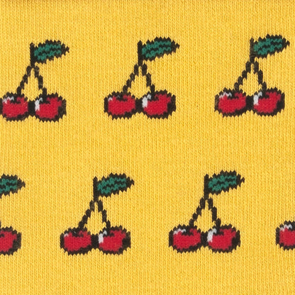 Close-up of the red cherries on yellow bamboo socks