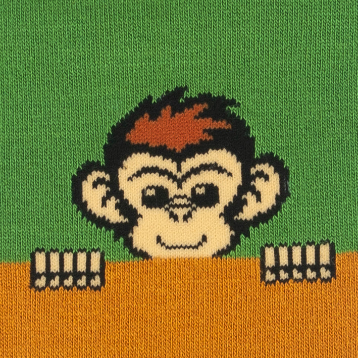 Close-up of the cheeky monkey peeking over the cuff